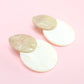 a acrylic earring in pearl color with beige